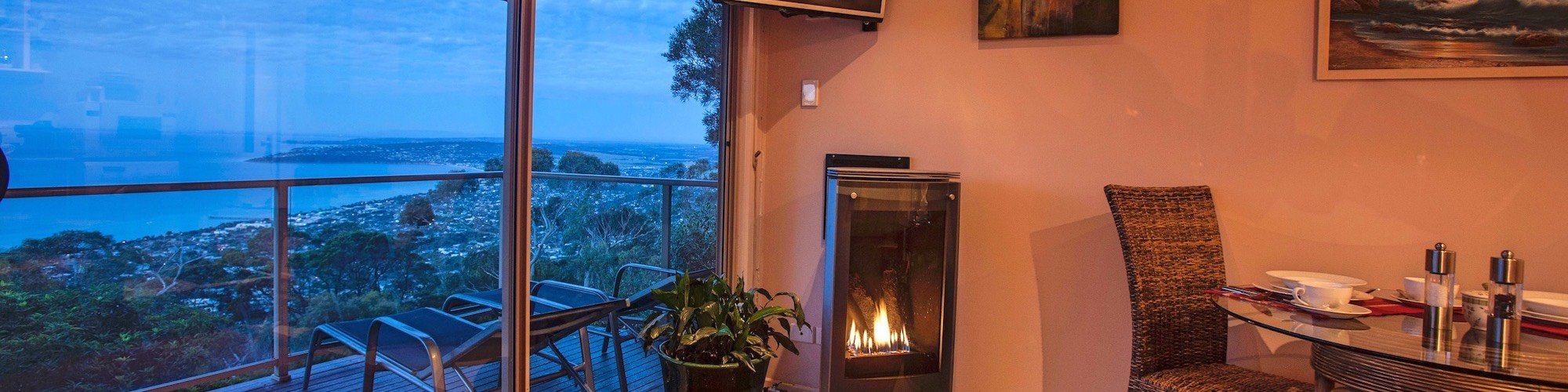 Elegant gas log fireplace at dusk - Summit Views Eagle Nest 